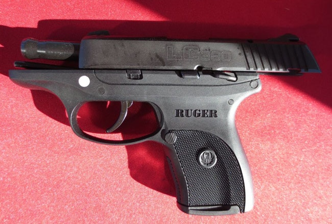 ruger lc380 sitting on red cloth