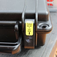 seahorse pressure release button on gun case
