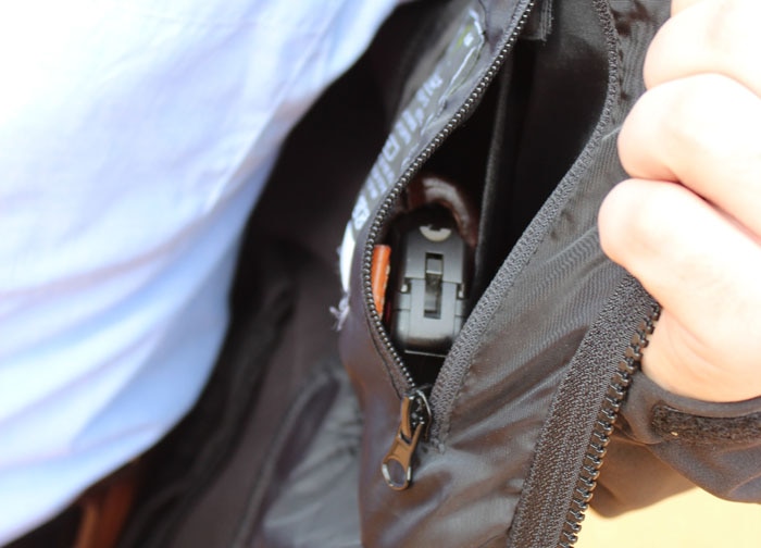 handgun concealed in inside pocket of haze jacket