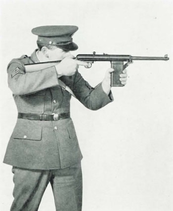 black and white photo of officer shooting rifle