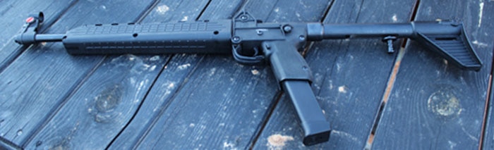 kel tec sub 2000 gun on wood table outdoors