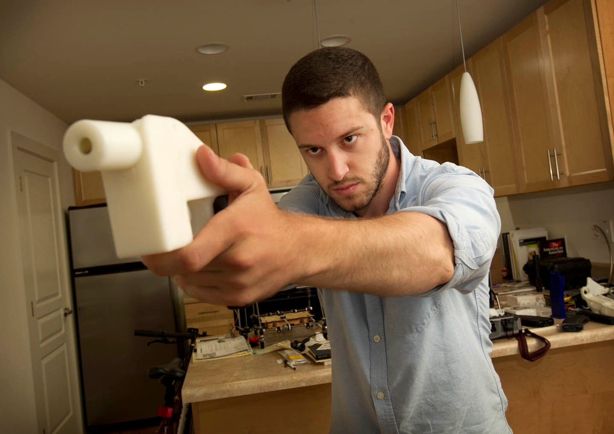 Cody Wilson holds a 3D printed pistol