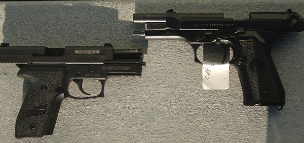 Sig Sauer P229 alongside the Beretta M9.
