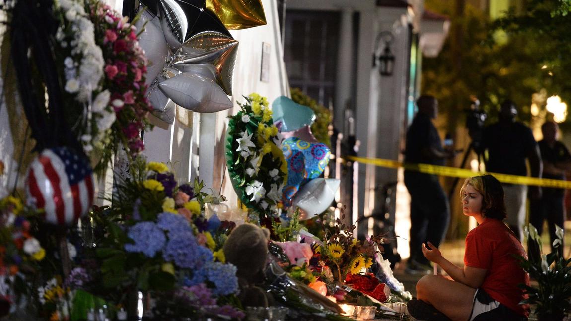 A young girl pays her respects outside Emanuel AME Church in Charleston, South Carolina on June 18, 2015. (Photo: AFP) 