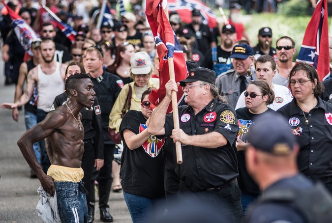 A man confronted members of the Ku Klux Klan on Saturday as they protested the removal of the Confederate battle flag from the grounds of the State House. (Photo: New York Times)
