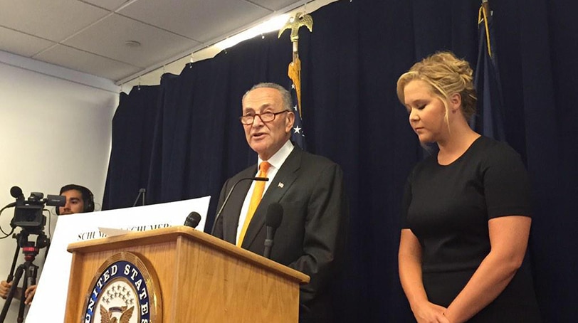 Actress Amy Schumer and New York Sen. Charles Schumer unveil legislation aimed at a NICS fix, calling on states to submit more mental health records. (Photo: Everytown) 