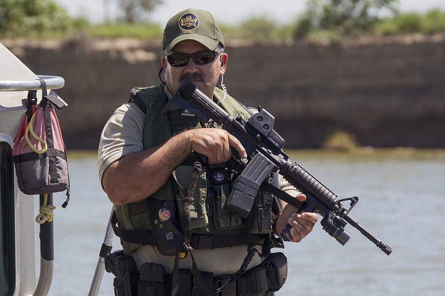A Border Patrol Riverine agent conducts patrols in an Air and Marine Safe-Boat in South Texas, McAllen, along the Rio Grande Valley river on September 24, 2013.
