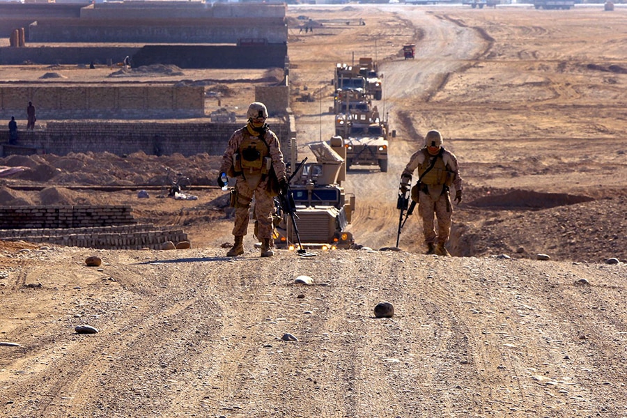 U.S. Marines use metal detectors to sweep a hill during a route reconnaissance mission of Route Red, which extends from Highway 1 to Shir Ghazay, Afghanistan, on Jan. 1, 2012. The Marines are assigned to the 2nd Platoon, Alpha Company, 9th Engineer Support Battalion, 2nd Marine Logistics Group. The purpose of the mission was to document inclines and declines in the route, sharpness of curves, the shortest width during the route, and where culverts were located or needed to be placed. (Photo: Department of Defense)