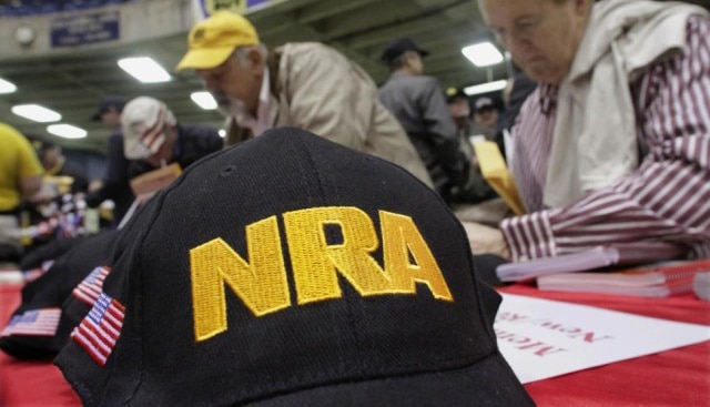 National Rifle Association hats at a public event.