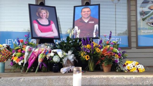 A memorial has popped up in front of the plaza where the shooting occurred. (Photo: Associated Press)