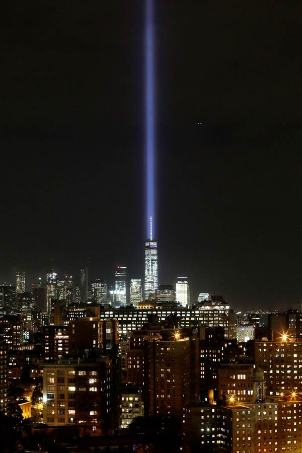  The Tribute in Light illuminates the sky behind One World Trade Center and the lower Manhattan skyline on Sept. 9. (Photo: Associated Press)