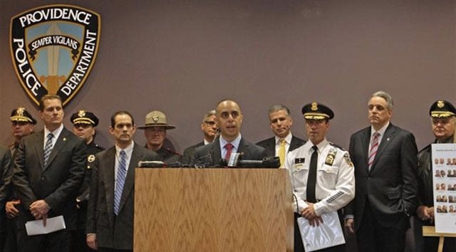 Officials in Providence hold a press conference after 35 people were arrested in February on charges stemming from drug and gun trafficking. (Photo: Steve Szydlowski / The Providence Journal)