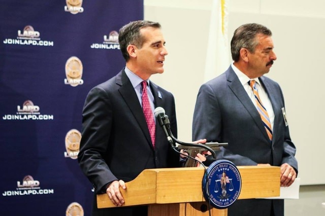 Mayor Eric Garcetti-- shown holding SDJ's M1911-- and LAPD Chief Charlie Beck presided over a press event this week showing off some of the guns turned in May 7. (Photo: LA Mayor's Office)
