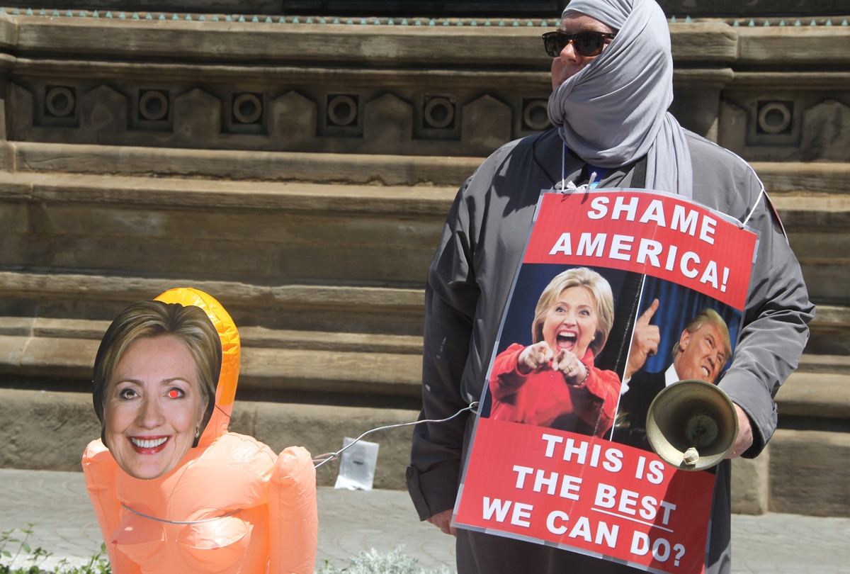A woman protesting both parties' candidates.