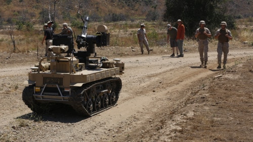 Marines with Kilo Company, 3rd Battalion, 5th Regiment, execute a patrol exercise with the robotic vehicle modular aboard Camp Pendleton, Calif., June 23, 2016. The system is still in development and will be used during exercise Rim of the Pacific. The Marine Corps Warfighting Laboratory is conducting a Marine Air-Ground Task Force Integrated Experiment to explore new gear and access its capabilities for potential future use. (U.S. Marine Corps photo by Lance Cpl. Frank Cordoba/Released)