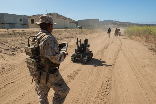 Pfc. Edgar Langle, an infantryman with 3rd Battalion, 5th Marine Regiment, operates a newly developed Modular Advanced Armed Robotic System in a field environment at Marine Corps Base Camp Pendleton, Calif., July 8, 2016. The system was built by the Marine Corps Warfighting Laboratory to assist Marines in carrying gear and clearing buildings. The lab is conducting a Marine Air-Ground Task Force Integrated Experiment in conjunction with Rim of the Pacific exercise to explore new gear and assess its capabilities for potential future use. The Warfighting Lab identifies possible challenges of the future, develops new warfighting concepts, and tests new ideas to help develop equipment that meets the challenges of the future operating environment.