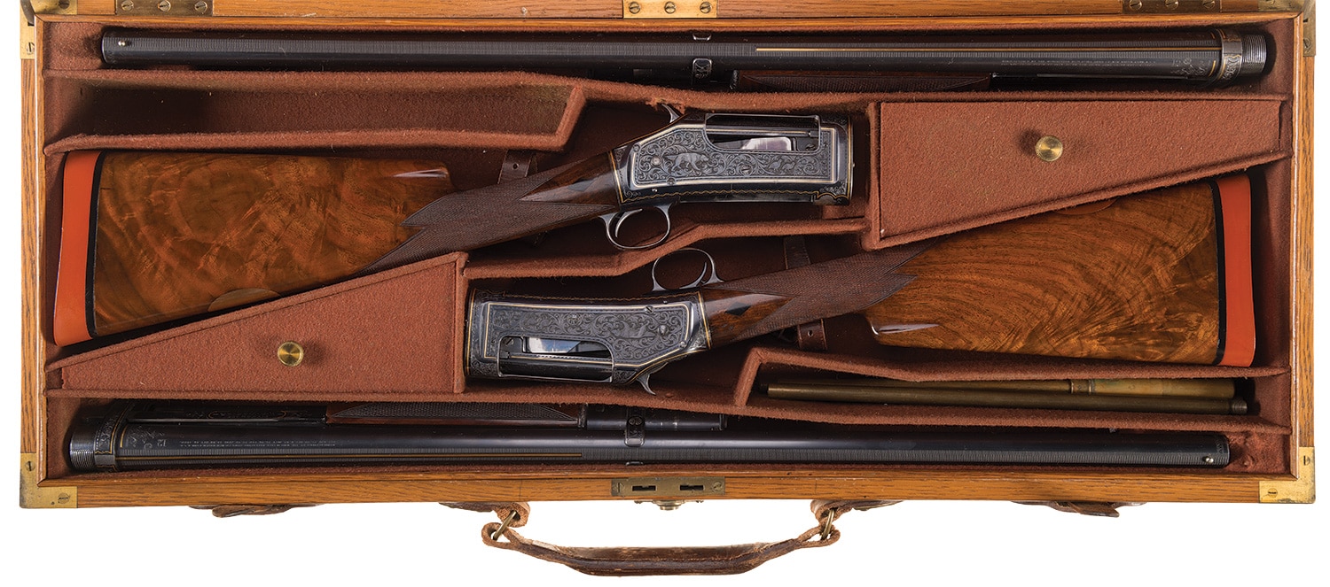 John Ulrich engraved and gold inlaid caseed and consecutively serialized Winchester Black Diamond Trap Models with 30-inch barrels 1905 1897