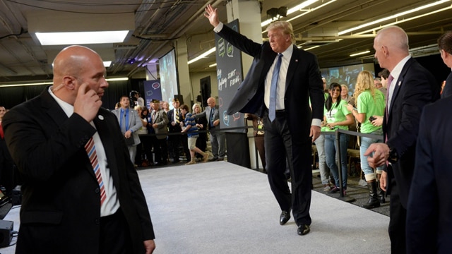 Secret Service agents escorting Republican Presidential candidate Donald Trump on October 12, 2015 in Manchester, New Hampshire. Eight presidential candidates addressed the bipartisan event which included many undecided New Hampshire voters. Darren McCollester/Getty Images