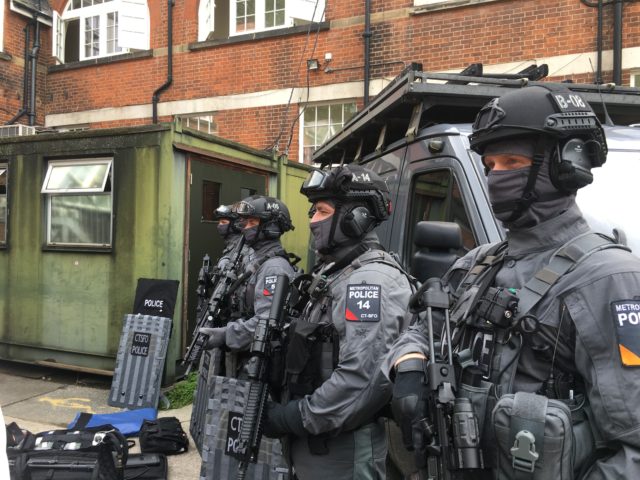 The "C-men" are heavily armed and armored, especially when compared to the traditional London cop. 