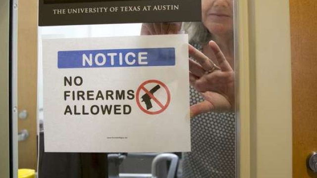 Jay Janner/The Statesman https://www.statesman.com/news/news/state-regional-govt-politics/paxton-wants-ut-professors-campus-carry-lawsuit-to/nr8Wq/ UT anthropology professor Pauline Strong posts a sign prohibiting guns at her office at the Student Activity Center on the first day of the new campus carry law Monday.