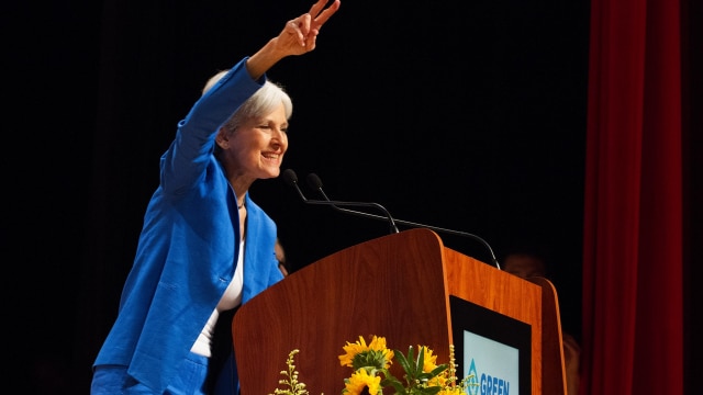 Jill Stein tosses her signature "peace sign" at the audience upon accepting the Green Party Presidential nomination at the 2016 Green Party National Convention. (Photo: Emily S. Chambers Photography via Jill Stein 2016)