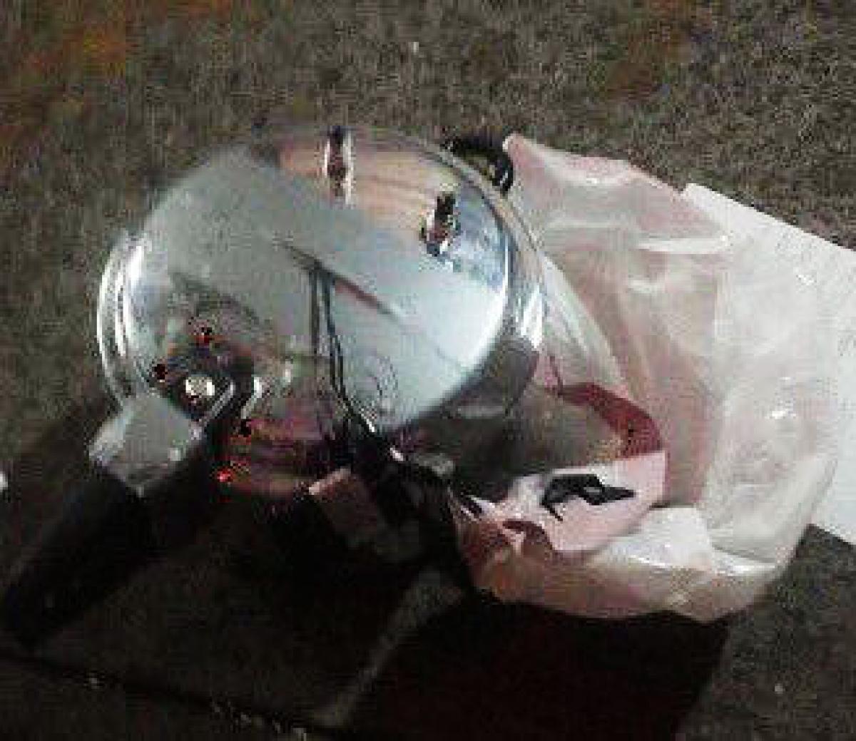 A pressure cooker bomb was found wrapped in a white garbage bag a few blocks from the first blast site. (Photo: NY Daily News)