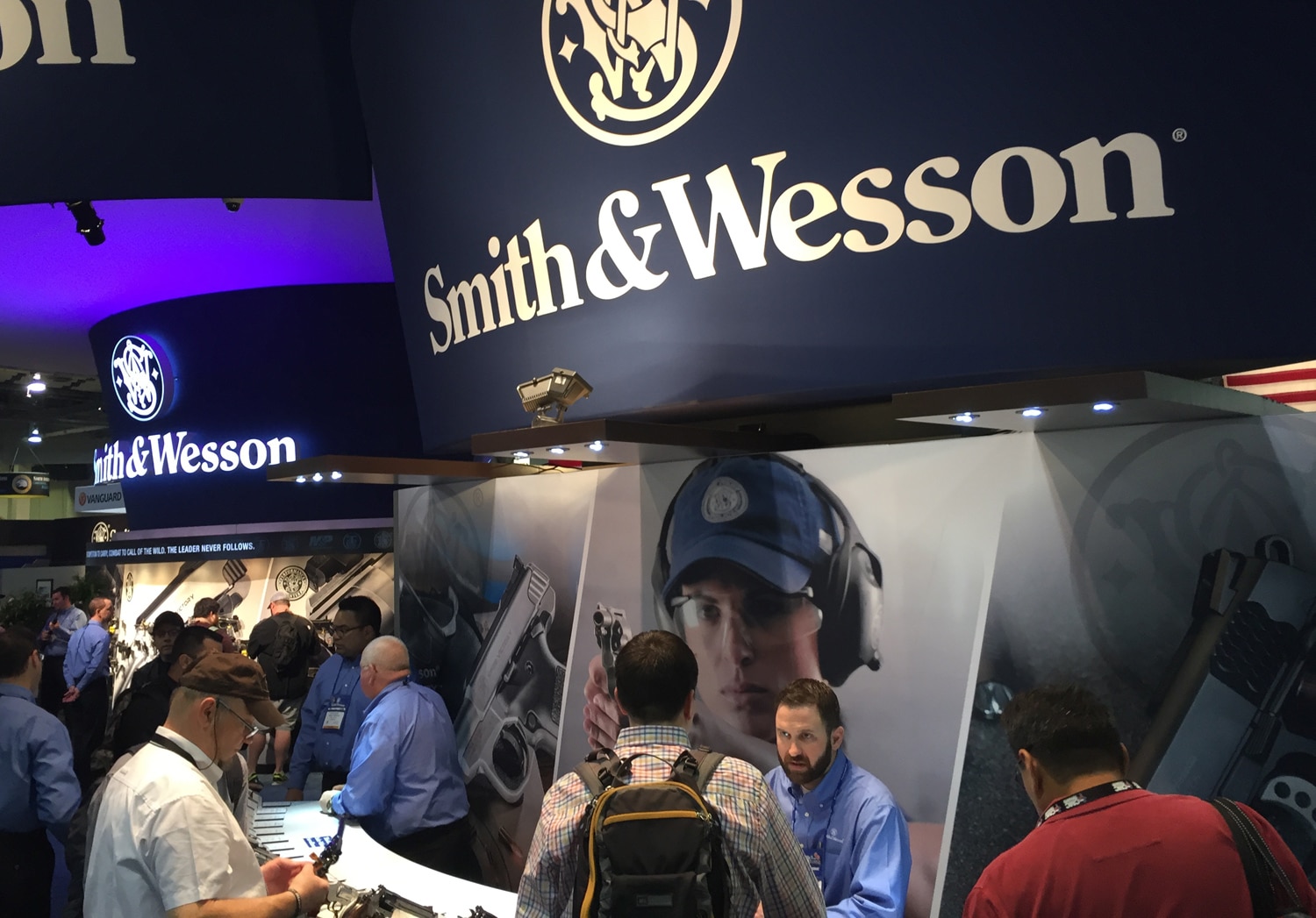 Representatives and patrons talking at the Smith & Wesson booth during SHOT Show in January 2016. (Photo: Daniel Terrill)