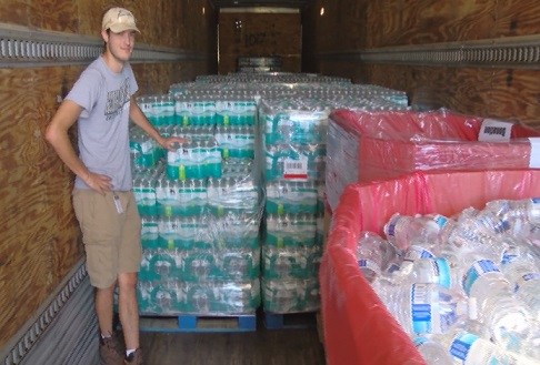A Daniel Defense employee prepares to hand out free water to Georgia residents impacted by Hurricane Matthew. (Photo: WTOC)