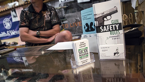 A Manchester, New Hampshire, gun dealer displaying suicide prevention pamphlets (Photo: John J. Happel/ The Christian Science Monitor)