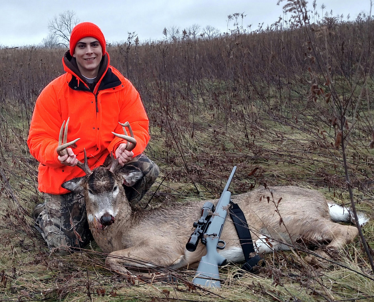 Michael LaPorte of Hartland, Wisconsin poses with the 8-point buck he shot last November. (Photo: Milwaukee Journal Sentinel)