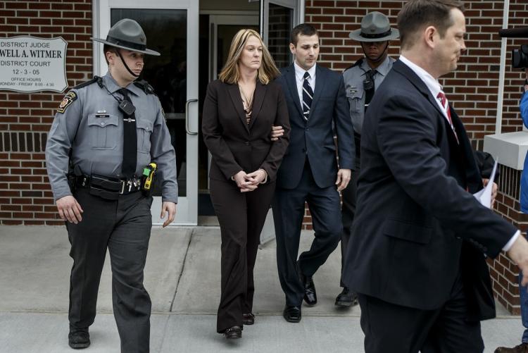 Hummelstown Police Officer Lisa J. Mearkle being escorted from a West Hanover Township court Tuesday after being charged with criminal homicide in the shooting death of motorist David Kassick in February (Photo: Dan Gleiter/AP)