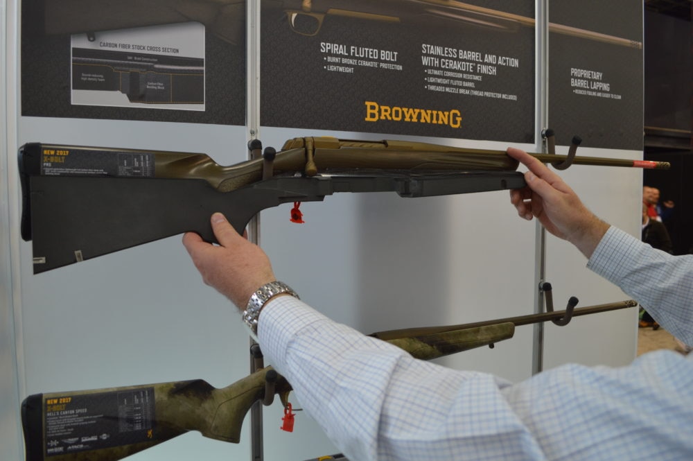 Browning's new-for-2017 bronze-cerakoted X-Bolt rifle comes chambered in 6.5 Creedmoor. A company rep shows off a cutaway of this model's carbon fiber stock. (Photo: Kristin Alberts)