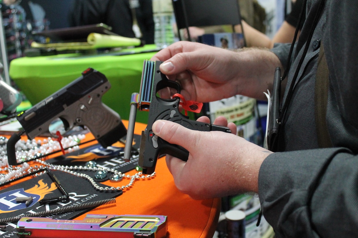 A SHOT Show attendee breaks down the PKO 9mm version for a better look at its inner workings. (Photo: Jacki Billings)