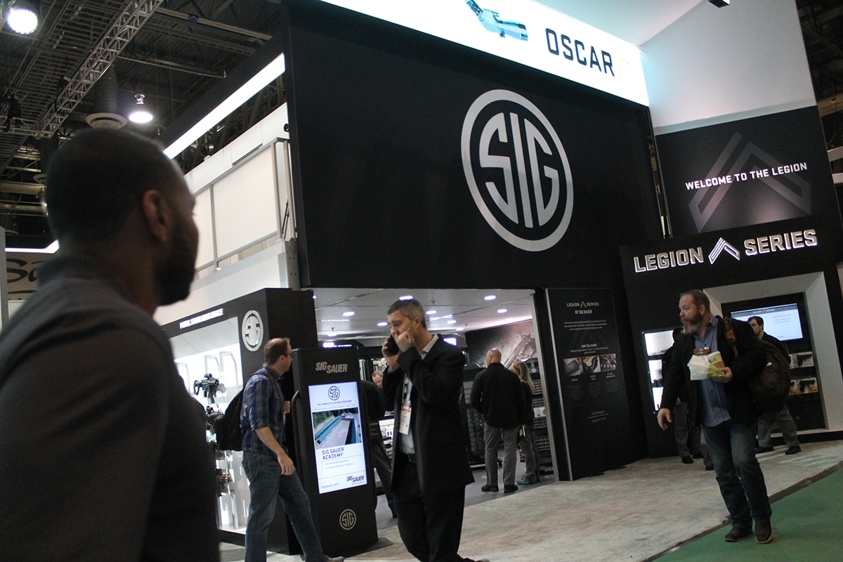 Sig's booth was packed with dealers and media wanting to catch a sneak peek at the newest models of pistols, rifles and optics. (Photo: Jacki Billings)