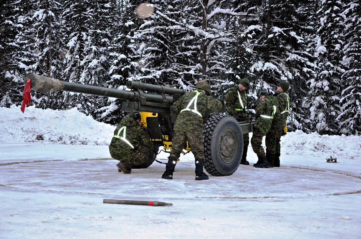 Troops from 1st Regiment, Royal Canadian Horse Artillery move the 105-mm C3 Howitzer gun in preparation for firing at Rogers Pass (2)