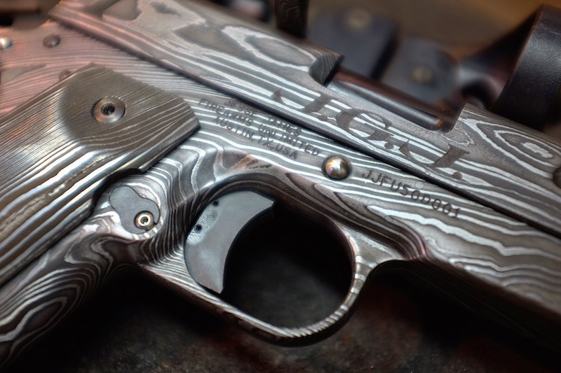 Though the pistol is forged from steel, it is engraved to look wood-like. (Photo: JJFU)