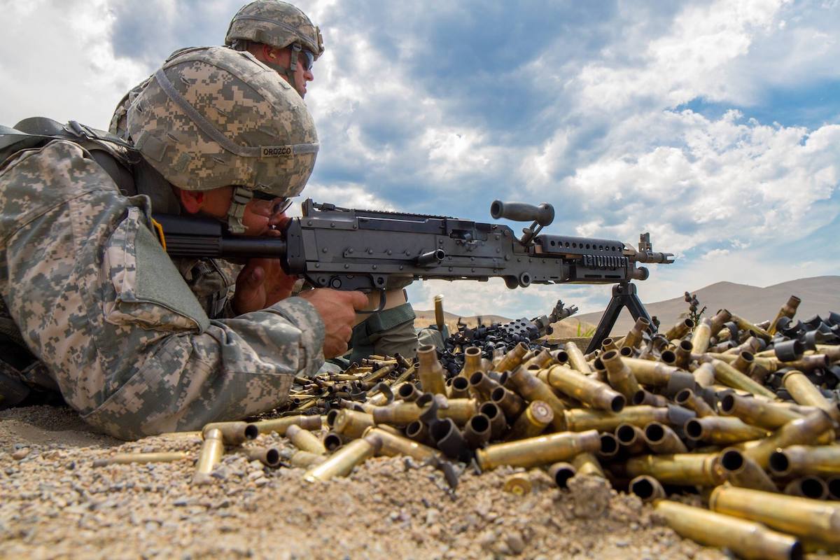 Caption: An Army Soldier fires a M-240 machine gun, chambered in 7.62, during the U.S. Army Reserve's Best Warrior competition at Fort Harrison, Montana. (Photo: Calvin Reimold)