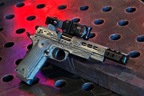 The Damascus Cisco 1911 features an ornately designed body as well as perks like a side mounted red dot sight and compensator. (Photo: JJFU)