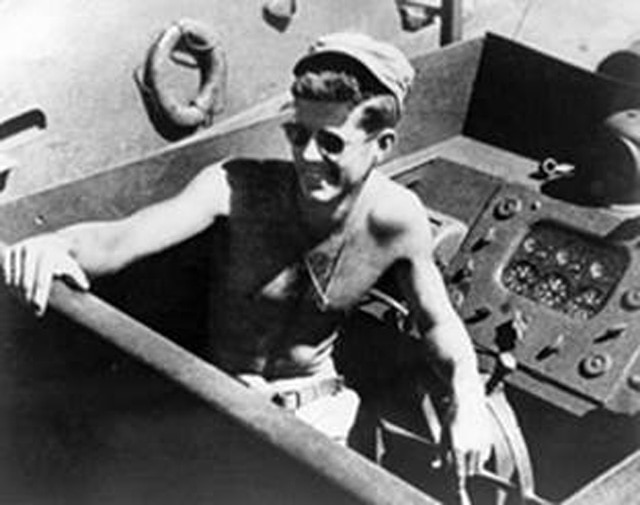 JFK shirtless on a battleship