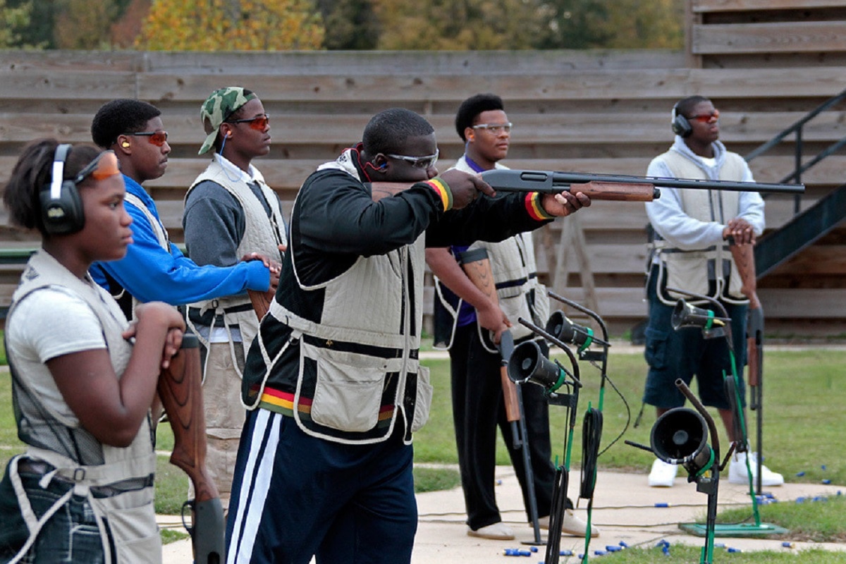 Members of the National African American Gun Association shoot firearms at an outdoor range (Photo: NAAGA)