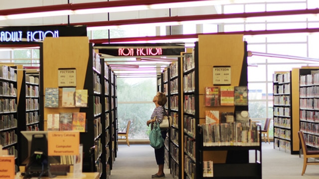 Connie Wilson of Las Vegas scans the bookshelves at the Rainbow branch of the Las Vegas-Clark County Library district on June 18, 2016 (Photo: Adelaide Chen/Las Vegas Review-Journal)