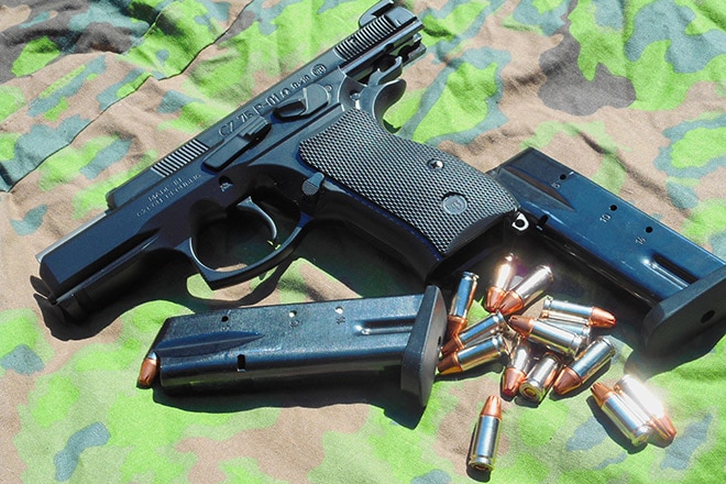 cz75 p01 omega with magazines and ammo on camo cloth