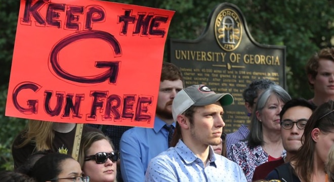 Students, faculty, and local residents protest at the University of Georgia to oppose a bill to allow the concealed carrying on campus (Photo: Curtis Compton/Atlanta Journal-Constitution)