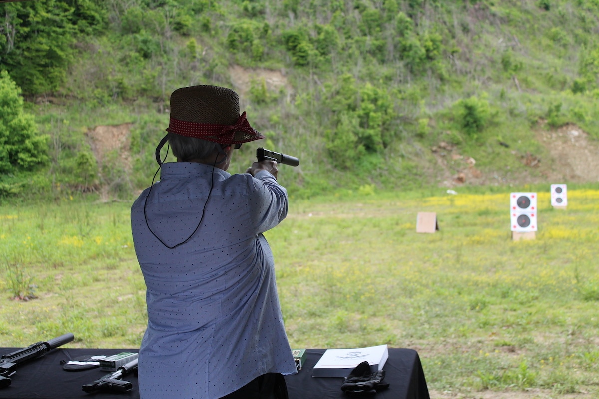 A woman takes aim at a target during a shooting event hosted during the National Rifle Association's Annual Meeting in 2016. (Photo: Jacki Billings)