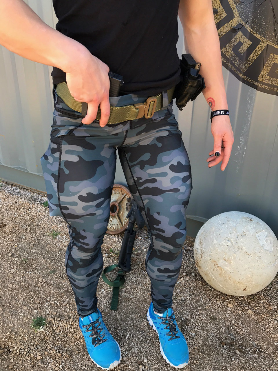 A model sports the Tactical Leggings in teal camo with her gun carried AIWB. (Photo: Rogue American Apparel)