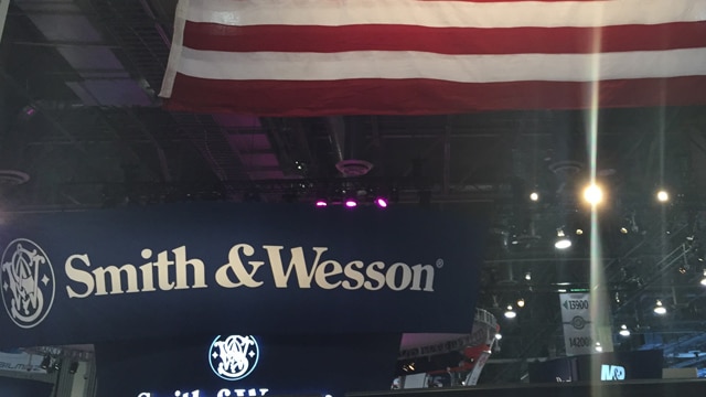 A Smith & Wesson sign below an American flag at SHOT Show 2017. (Photo: Daniel Terrill/Guns.com)