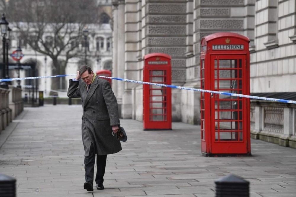 Chairman of the British Intelligence and Security Committee, Dominic Grieve walks to Parliament still on lockdown Thursday (Photo: Getty Images)