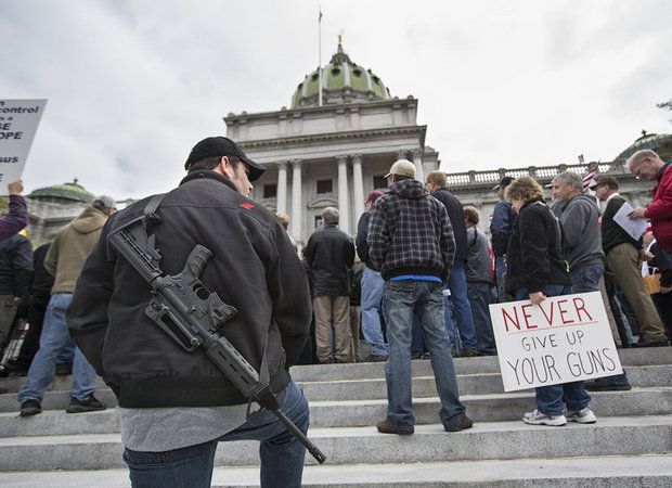 Christopher Kendra of York carries an AR-15 as he joins a large crowd gathered on the front steps of the Pennsylvania State Capitol Building for the Second Amendment Action Day in 2013 (Photo: Joe Hermitt/PennLive)