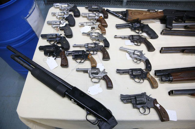 Newark confiscated handguns on table
