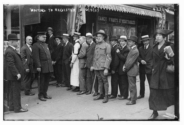 Line of men next to Bahnsen & Roeloffs grocery store in New York City, waiting to register for the draft during World War I. (Photo: Library of Congress) 